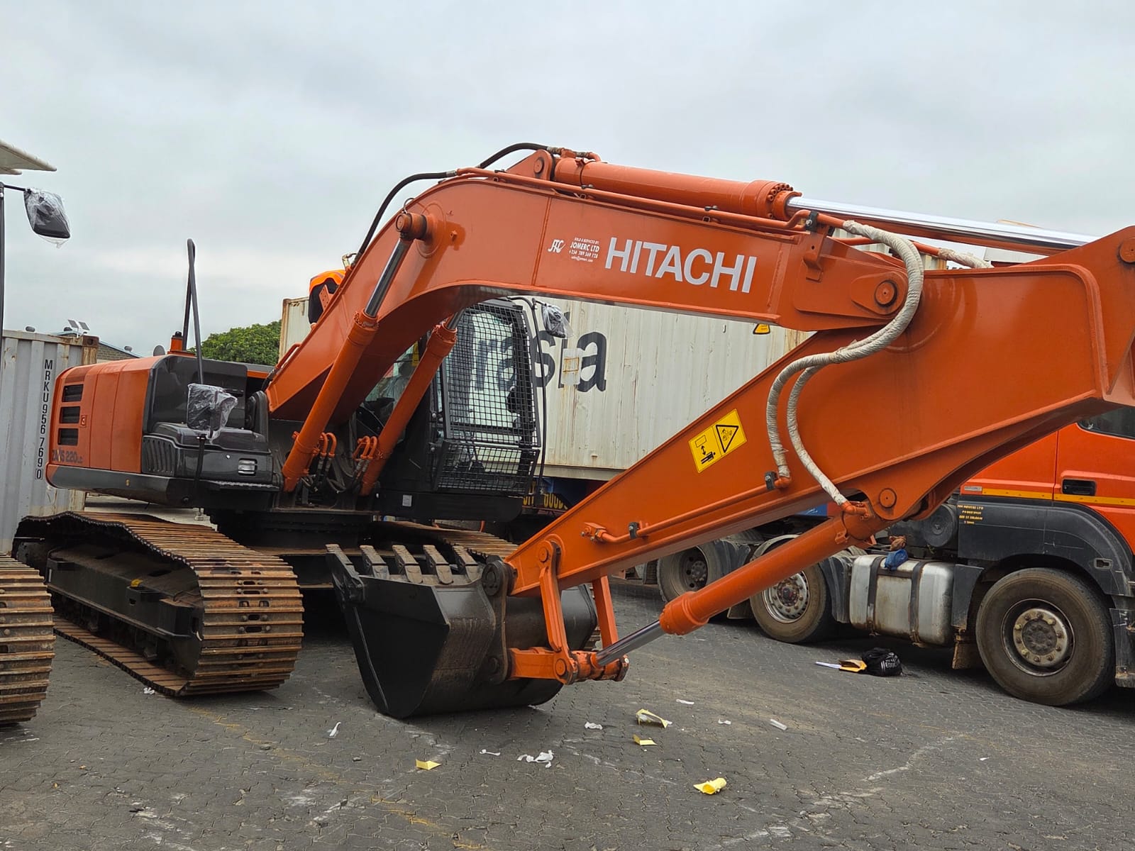 Hitachi excavator fleet with boom arms raised
